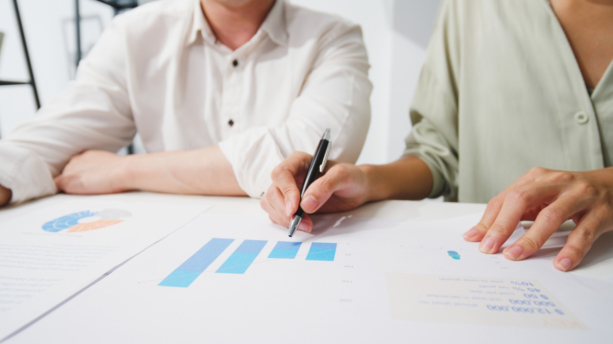 employees analyzing workforce cost benchmarks