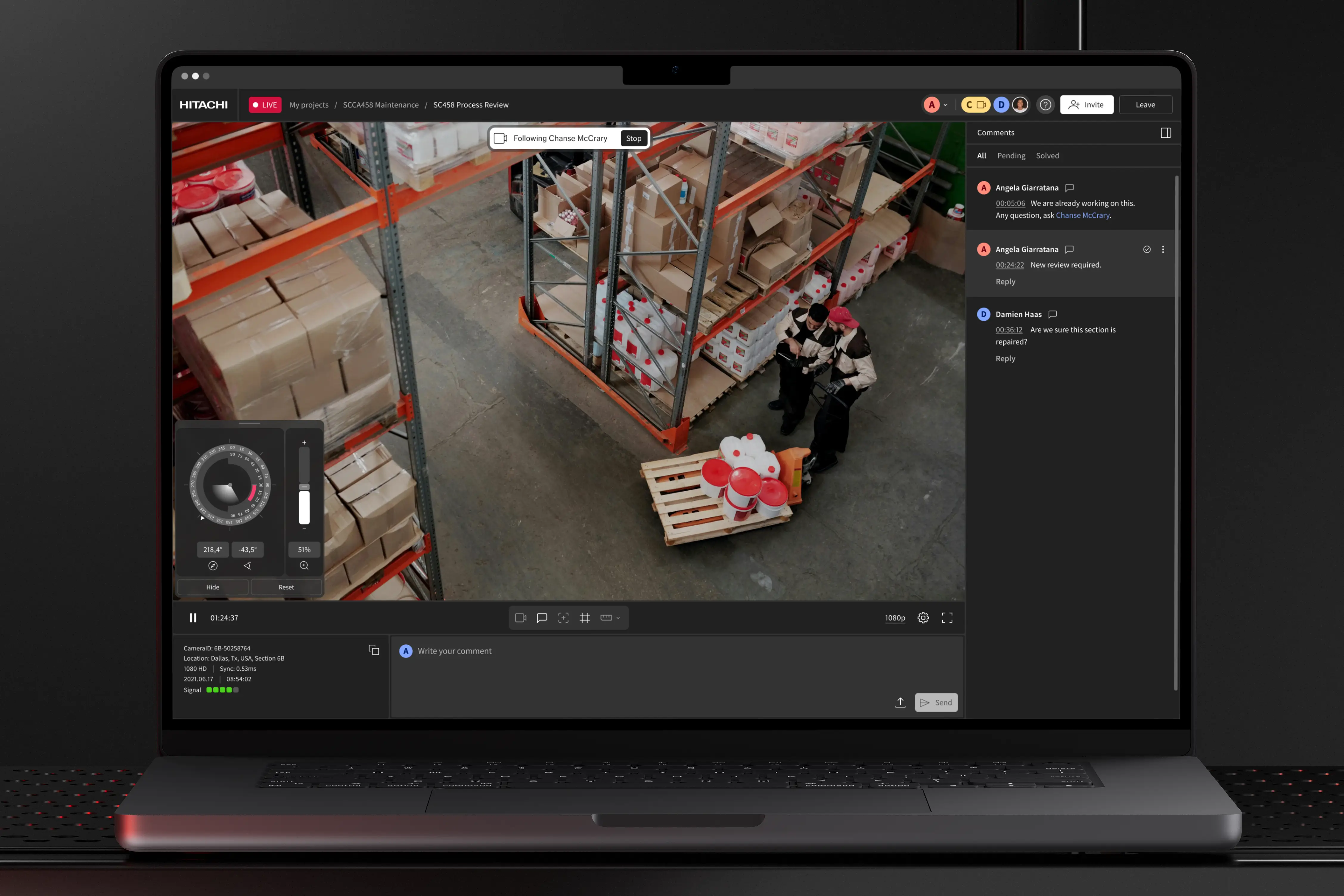 Laptop screen showing a warehouse video feed with two workers in uniforms inspecting items on a pallet, alongside a live comments section and video controls.