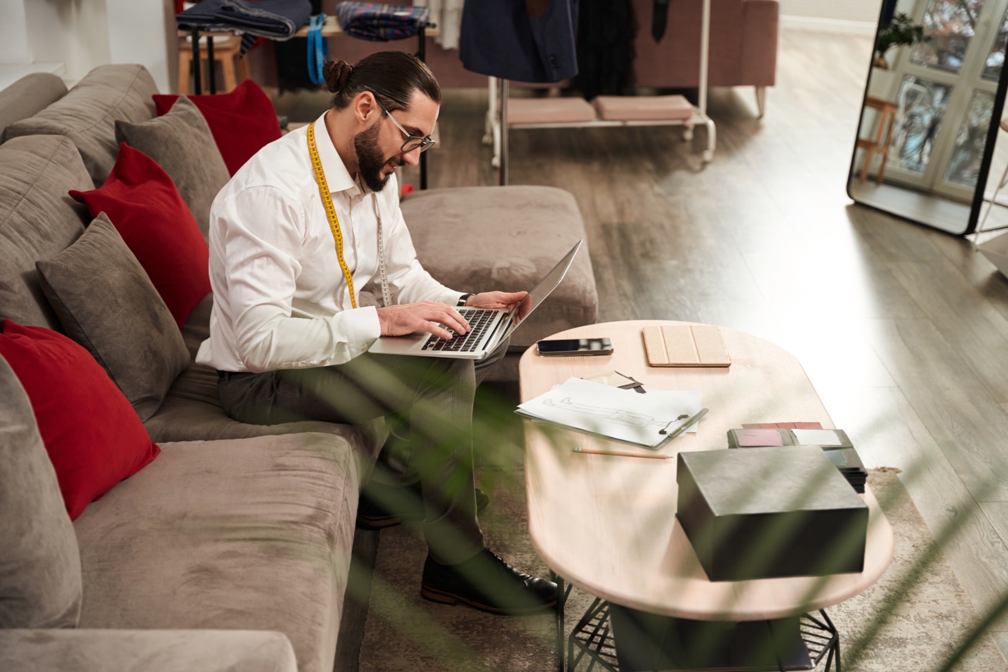 sales rep qualifying leads, B2B sales professional workspace, lead qualification research, sales development rep desk, prospect research laptop work, sales professional office setting, qualified pipeline research