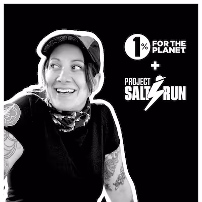 A black and white photo of a woman smiling with the 1% for the Planet and Project Salt Run logo.