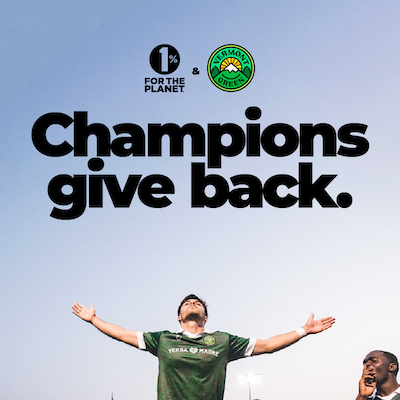 Athlete with his hands up with text that says, "Champions give back."