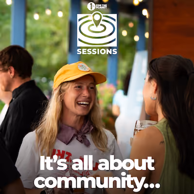 A person smiling at an event with text that says, "It's all about community..."