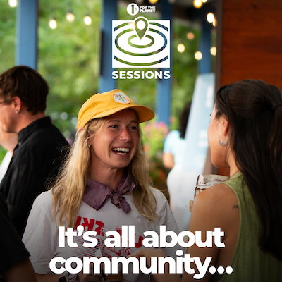 A person smiling at an event with text that says, "It's all about community..."