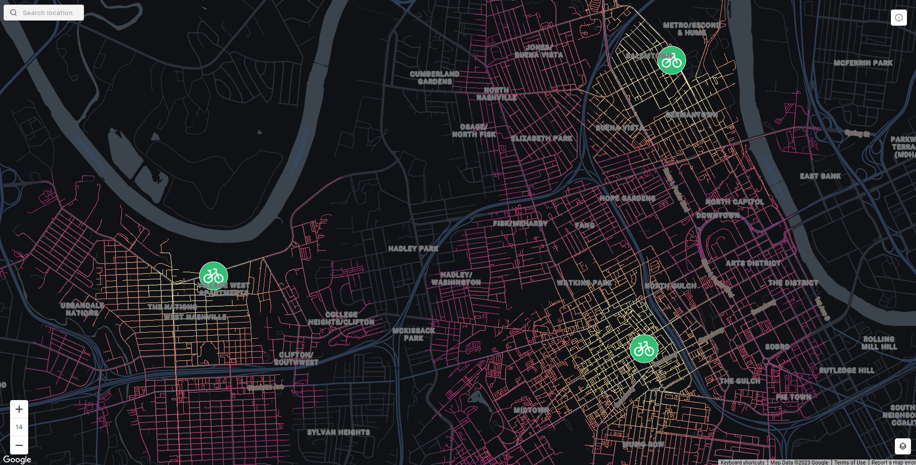 A map showing the output of the ROUTING_ISOLINES function. There are 3 points indicating micromobility hubs with a bike icon on them. The road lines start of bright yellow near these points, and get darker as it takes longer to reach them  by bike. 