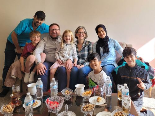 Mentor and mentee families smiling together