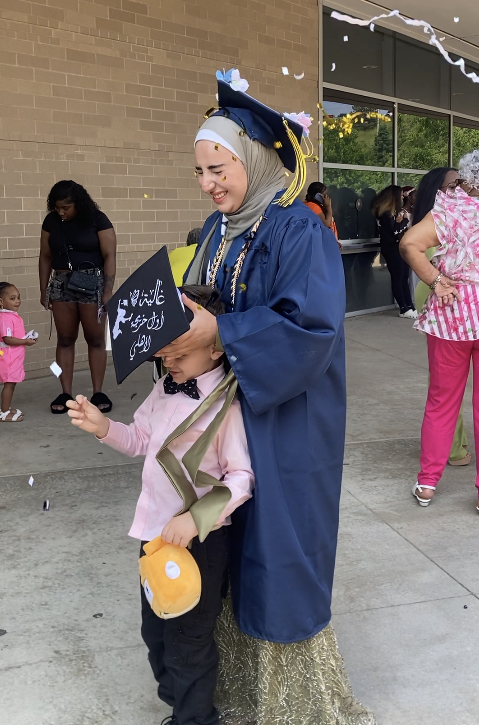Lina celebrating graduation with family