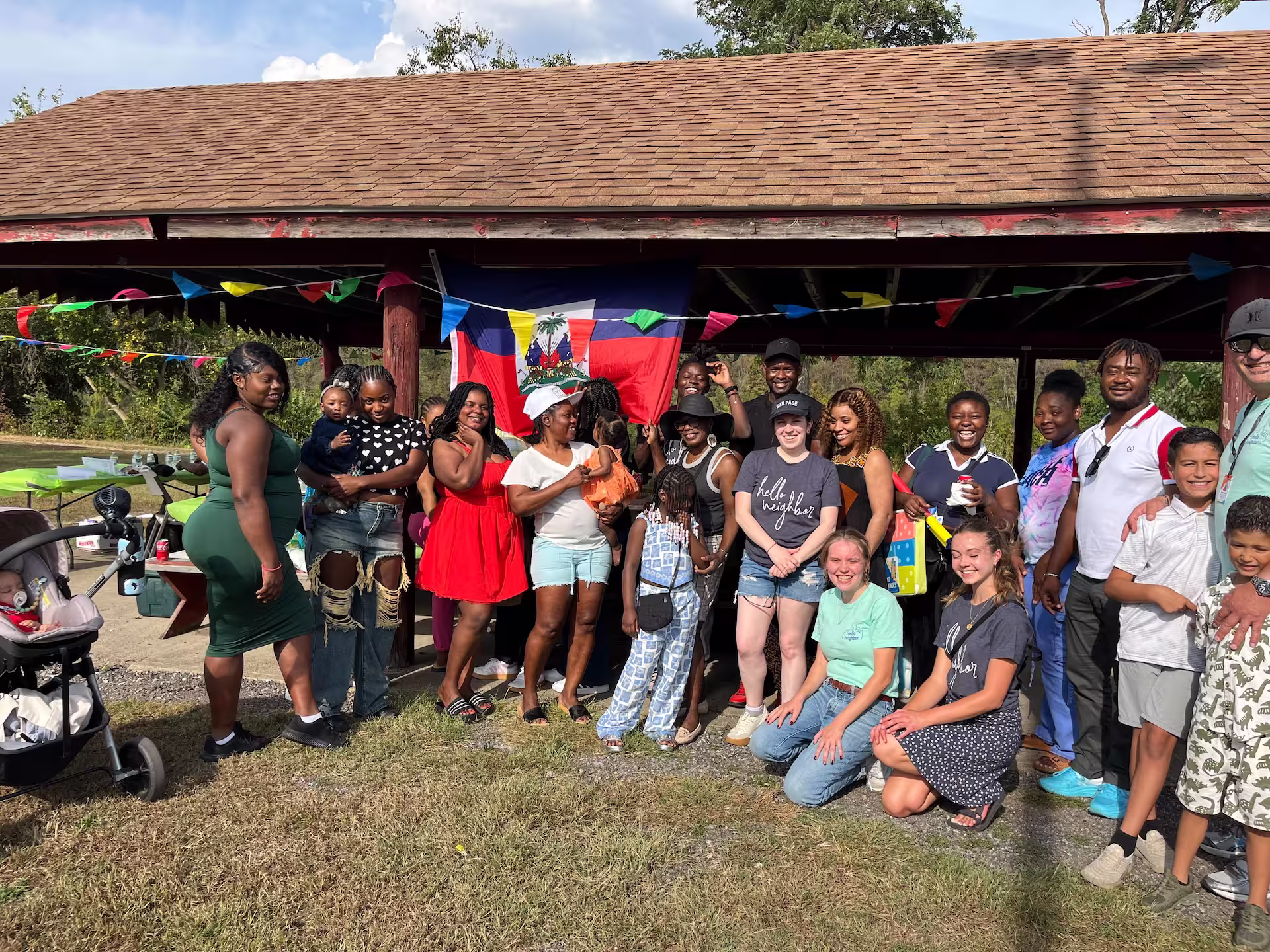 A group photo of local Haitian families  who have found support through Hello Neighbor.