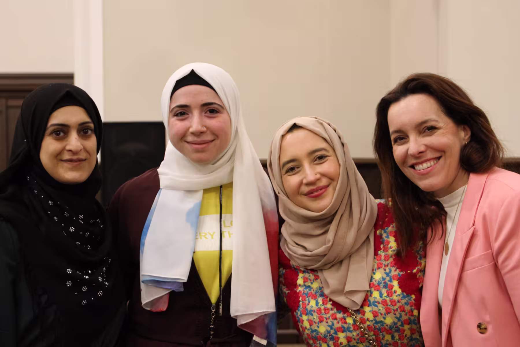 Hello Neighbor Founder and CEO, Sloane Davidson pictured with a group of muslim women.