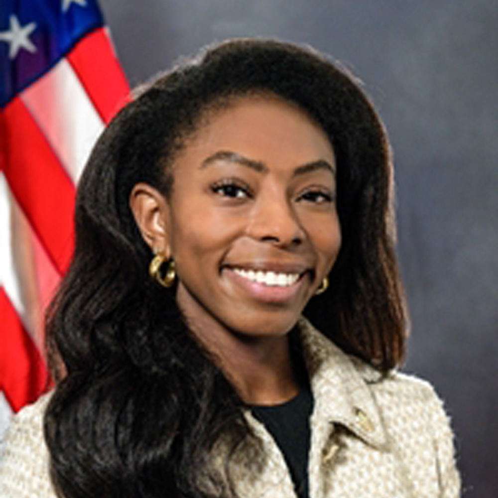 PA House Representative Lindsay Powell headshot in front of American flag
