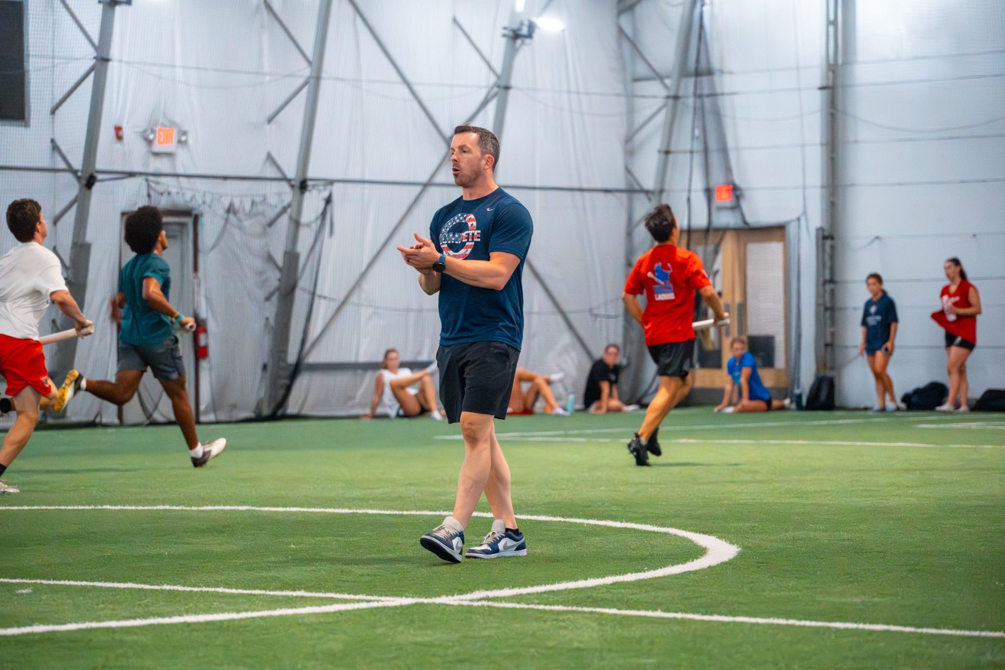 Joe Drain Coaching in the Indoor Field in Norwood MA