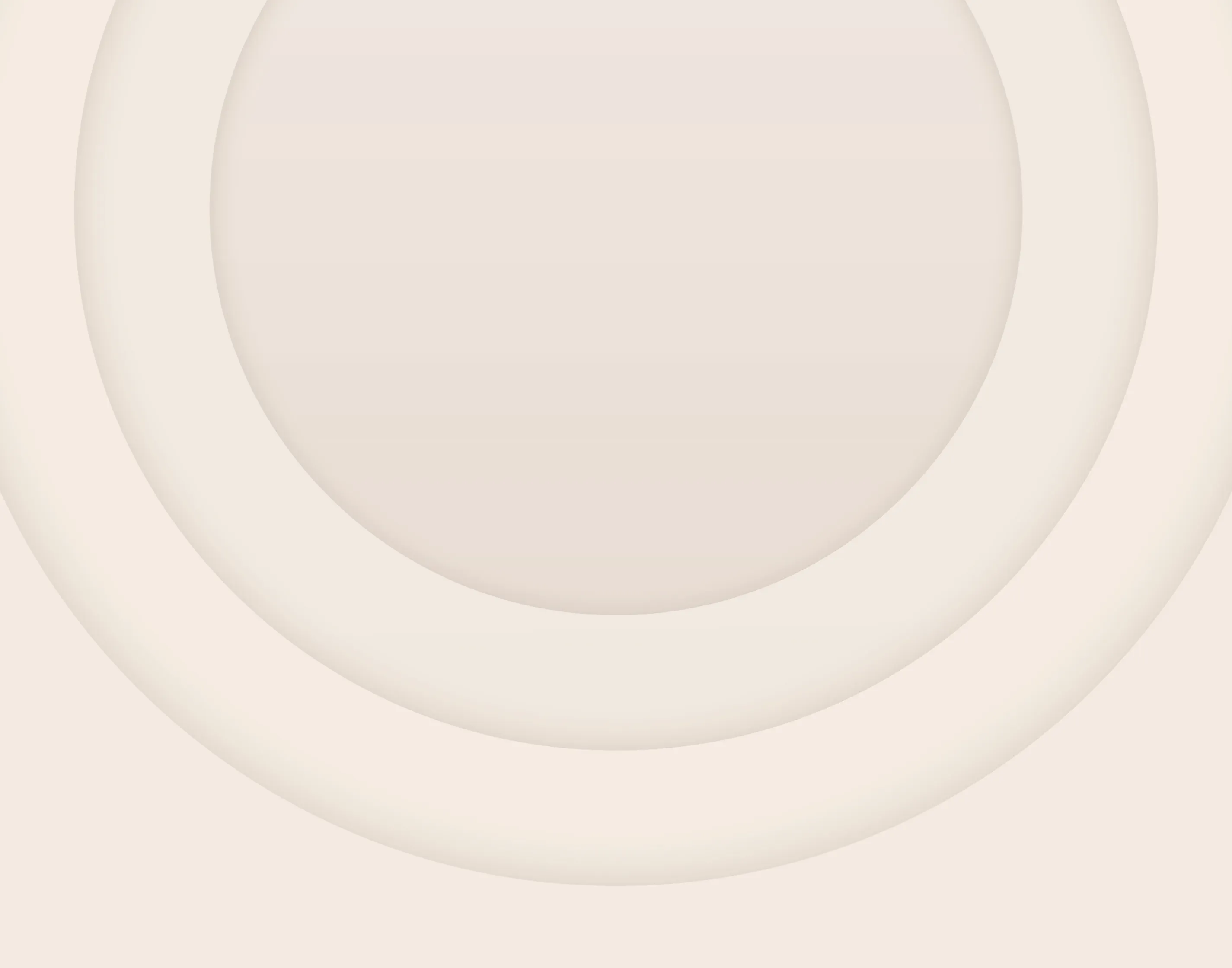 A farmer hammering fence posts into the ground wearing ear muffs for protection