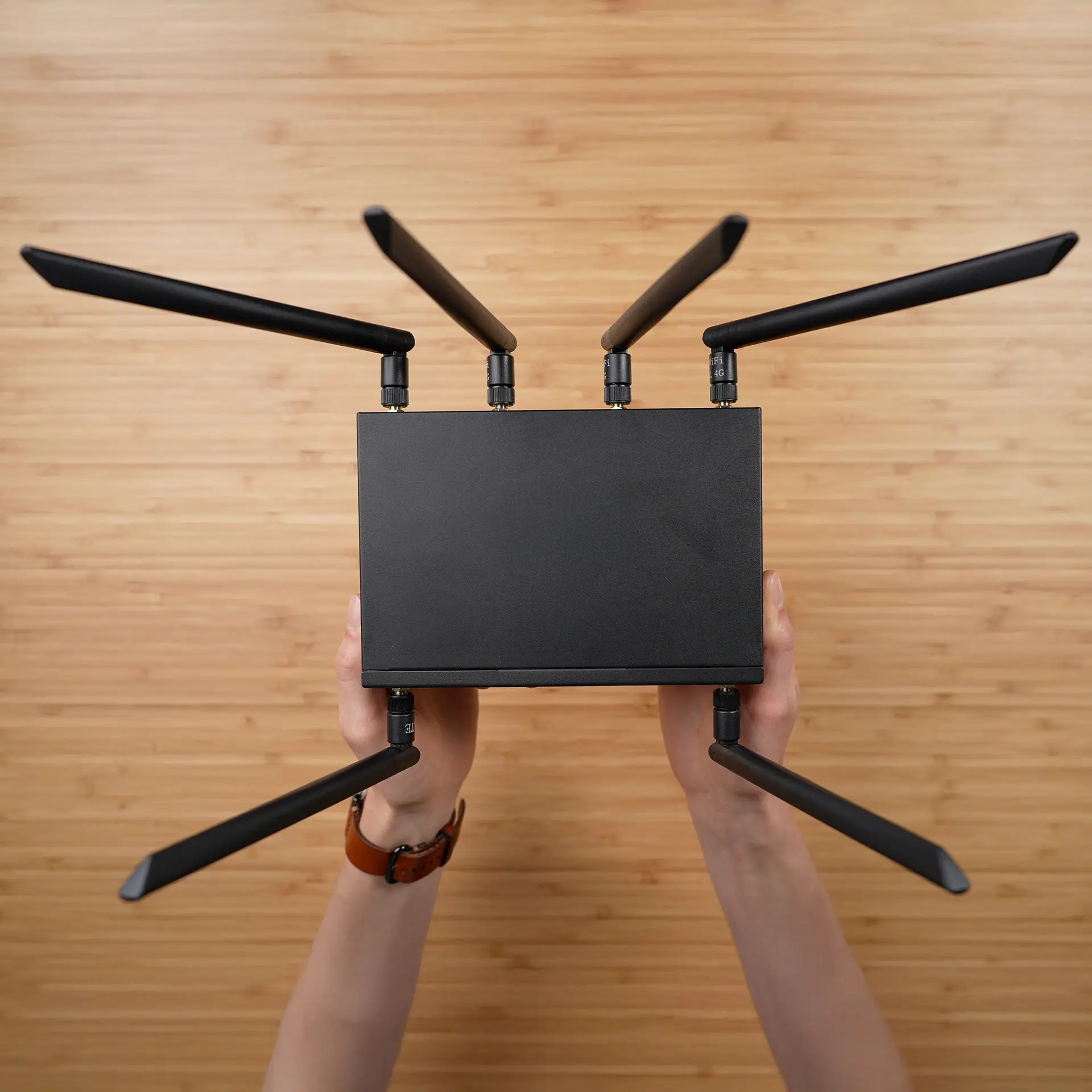 Hands holding a cellular router