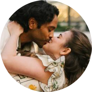 Louisa and Brian sharing a kiss on their wedding day — happy couple from their five‑star review.