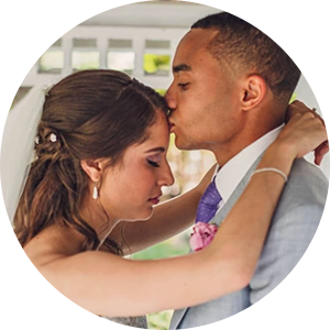 Jesse kisses Kat’s forehead — intimate moment from their five‑star review.