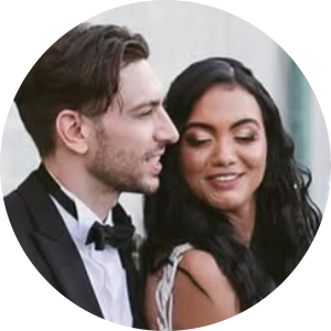 Luisa and David seated together, smiling and relaxed — newlyweds from their five‑star review.