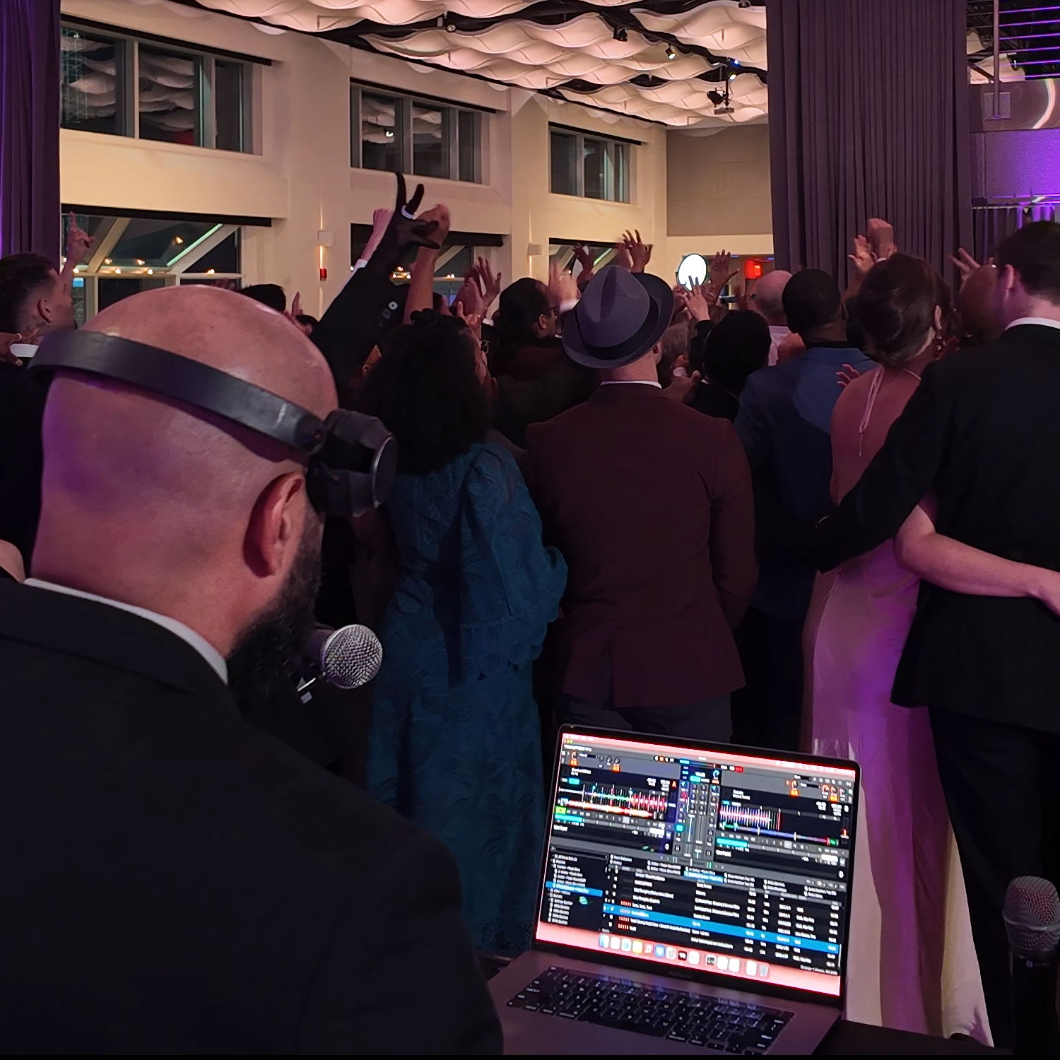 Current at Pier 60, Manhattan — Kenny Fiesta DJing to a packed dance floor with hands up; high‑energy reception.