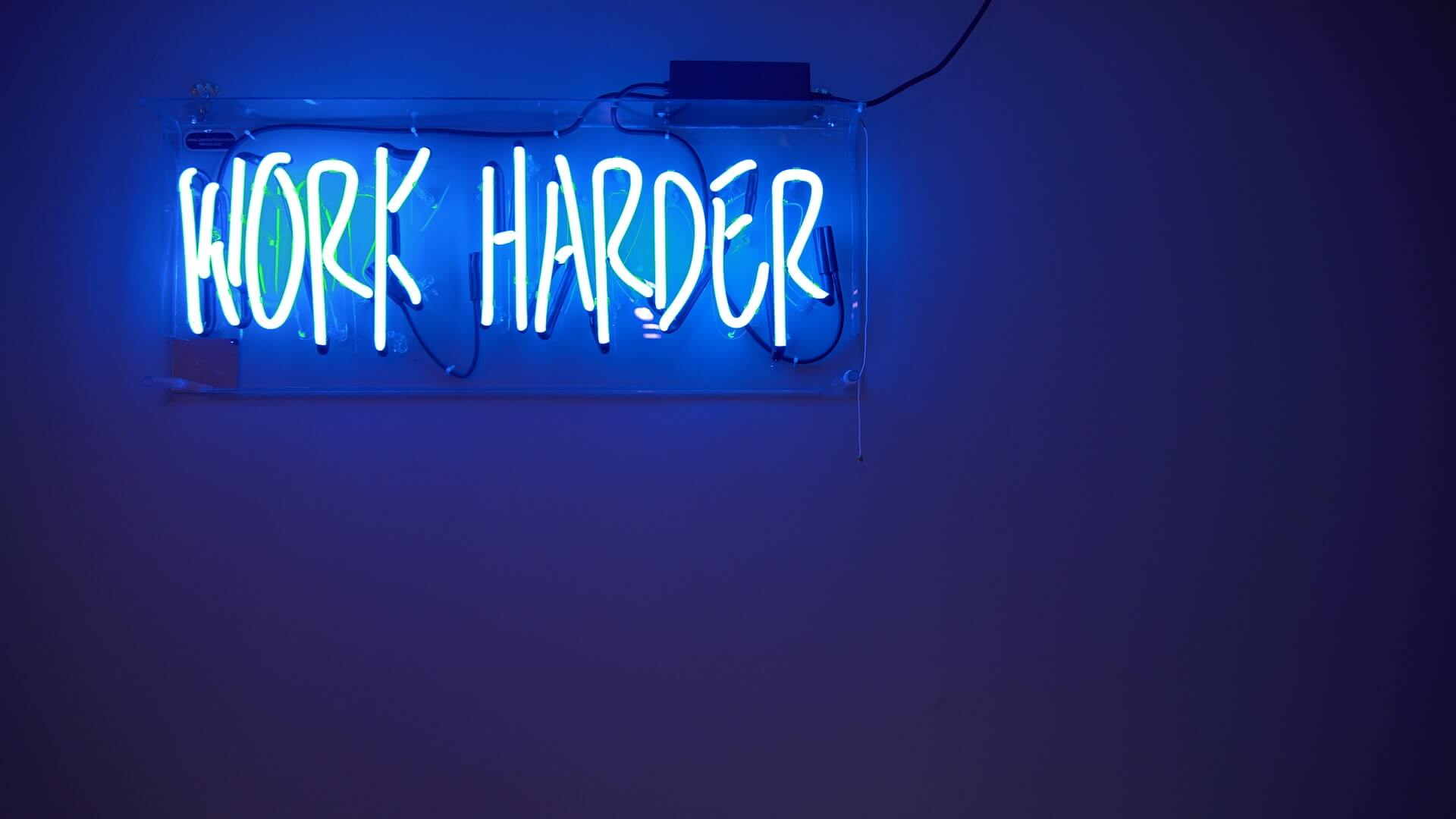 Work harder blue neon sign