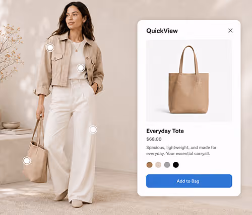Woman holding a beige Everyday Tote bag with product details and Add to Bag button on screen.