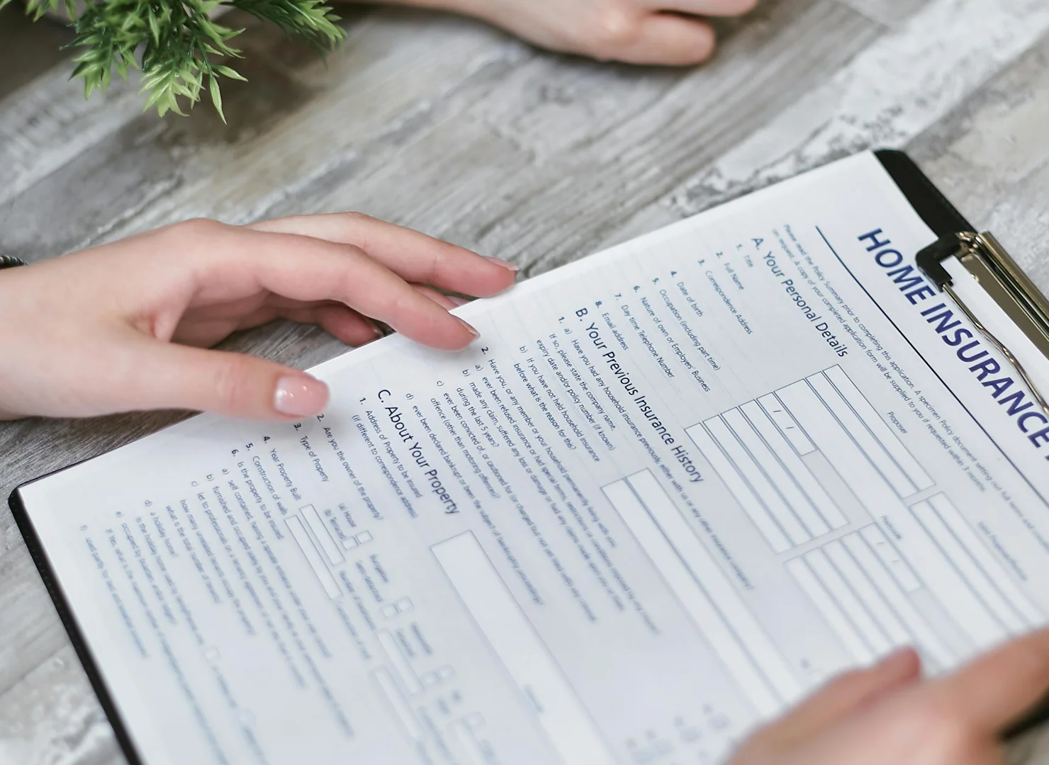 Homeowner reviewing insurance documents Homeowner reviewing insurance documents