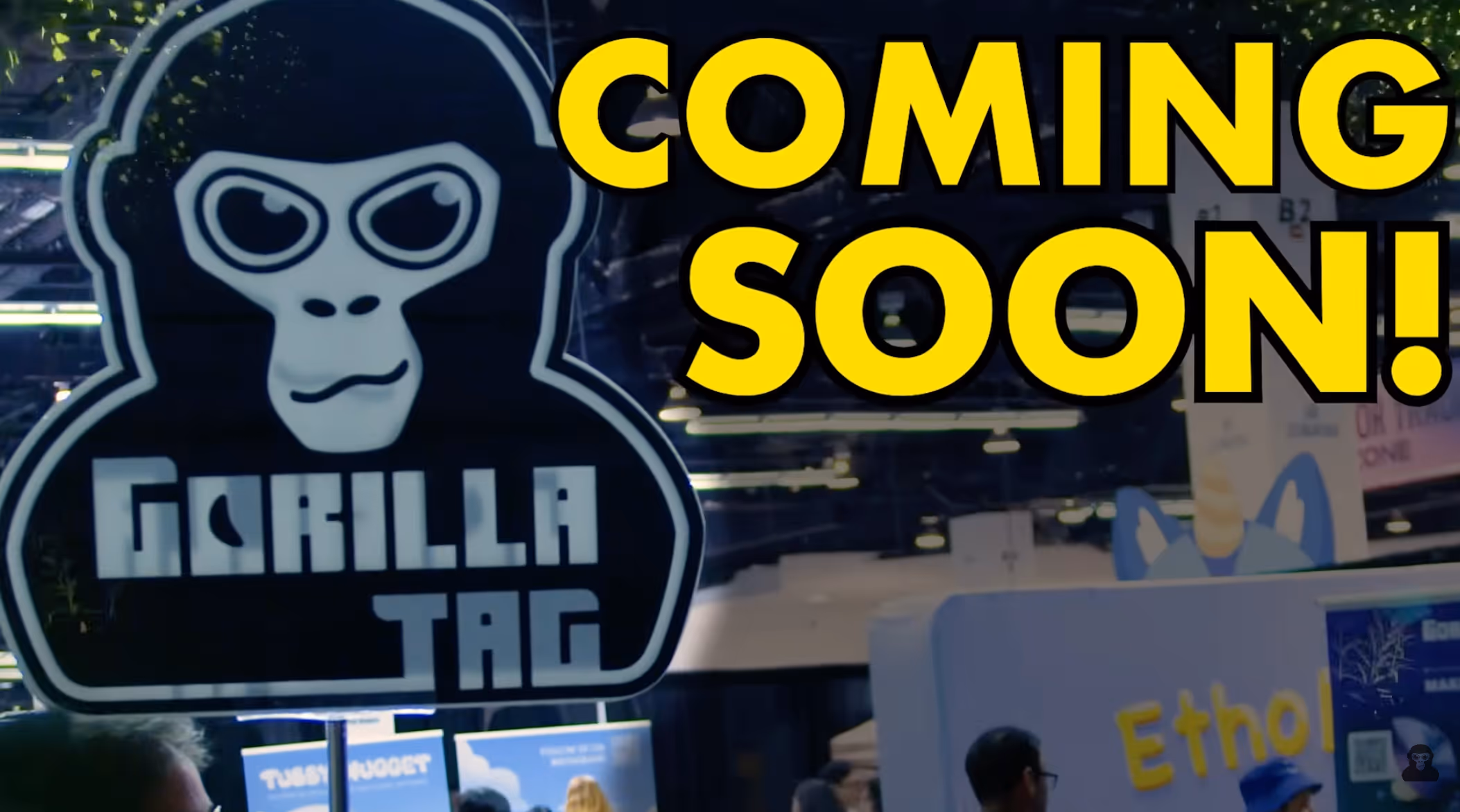 Sign with a gorilla face and text 'Gorilla Tag' next to large yellow text reading 'COMING SOON!' at an indoor event.