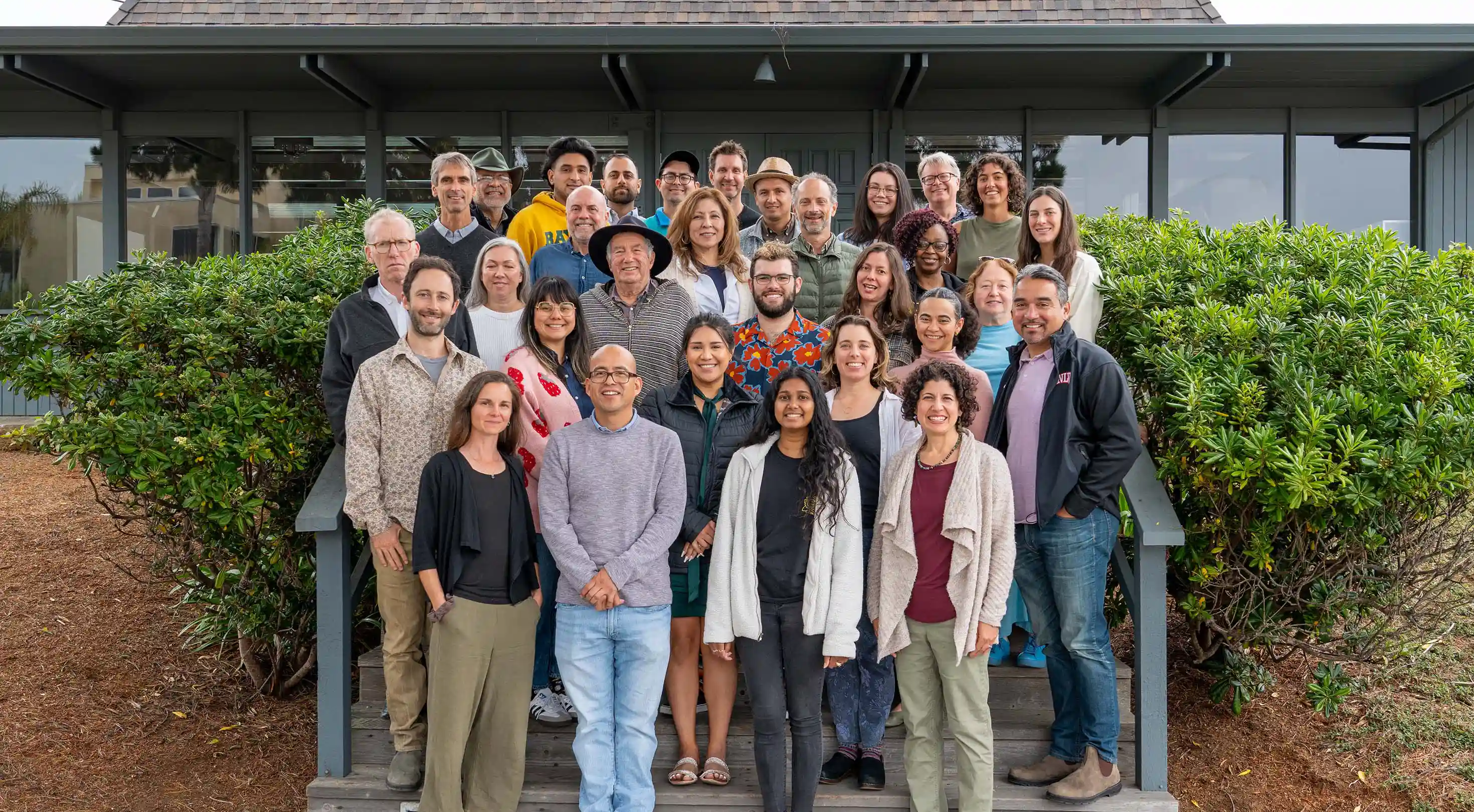 farmlink staff stand for group portrait in front of building.