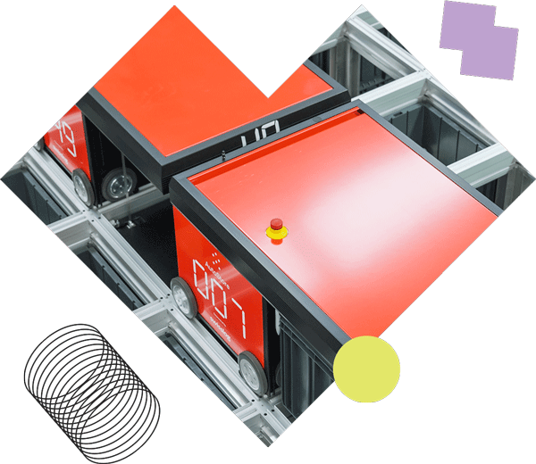 A red box with a yellow ball on top of it.