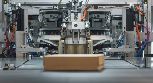 A box is sitting on a conveyor belt.