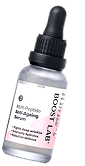 A bottle of anti-aging serum with a pink cap.
