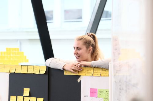 A girl observing the work of another team