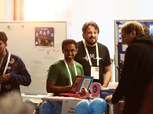 Team Caremates standing on stairs