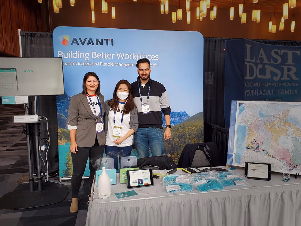 Emma, Cindy, and Hasham at the Avanti booth