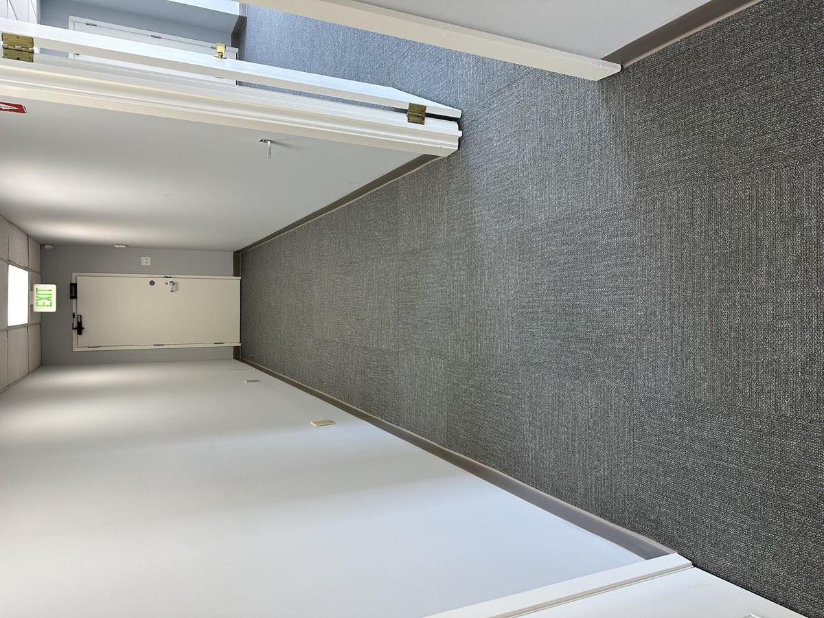 Interface carpet tile installation in a commercial corridor at the Boys and Girls Chorus in Downtown San Francisco