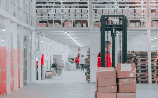 A man standing in front of a stack of boxes.