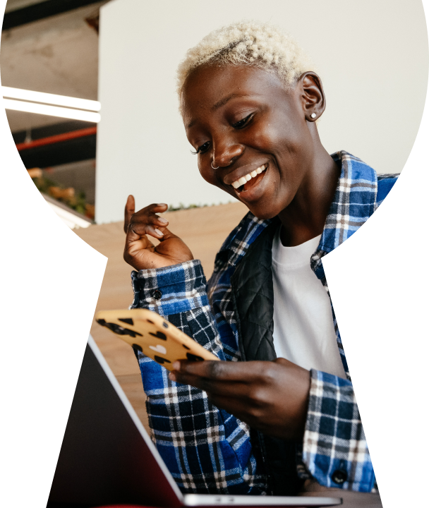 A woman with a cell phone in her hand.