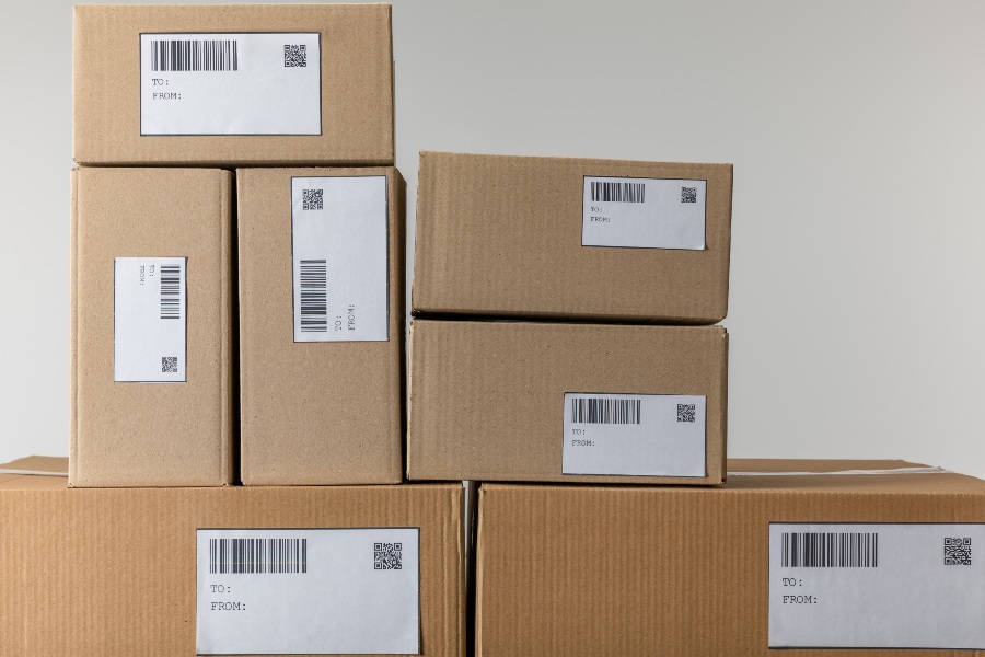 Unbranded shipping boxes prepared for white label delivery as part of a seamless fulfilment solution.