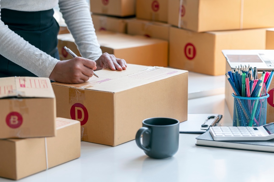Unbranded parcels prepared for white label shipping, highlighting cost-effective fulfilment benefits.