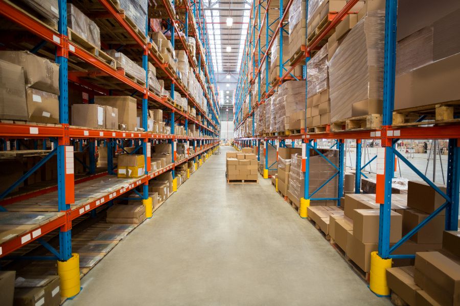 Organised warehouse racks and boxes showing efficient distribution centre design.