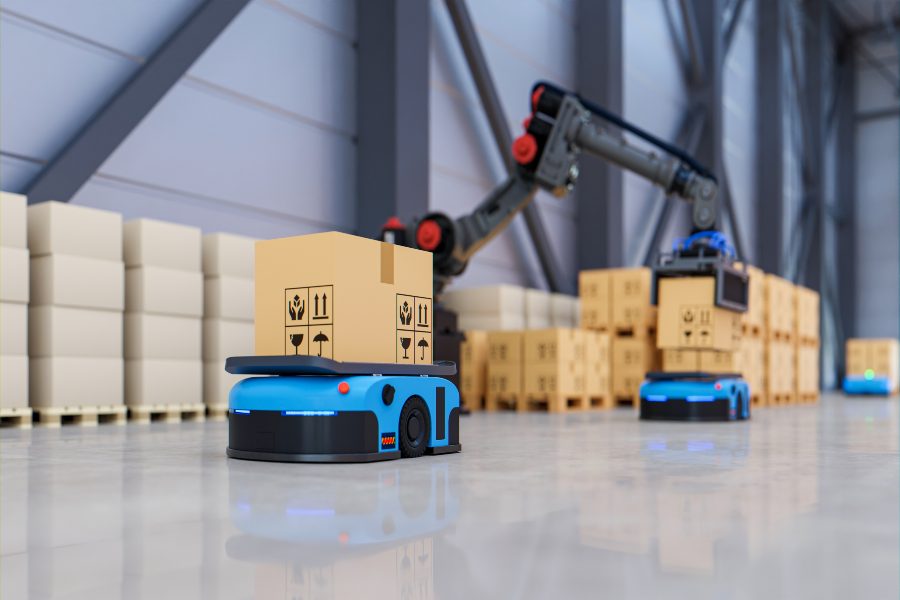 Robotic arm loading box onto AMR, illustrating AutoStore vs AMR fulfilment approaches