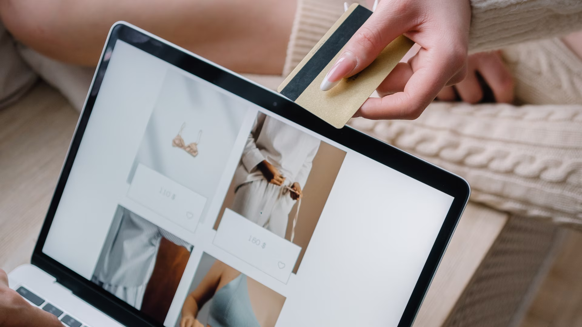 Online shopper paying with a card on a laptop