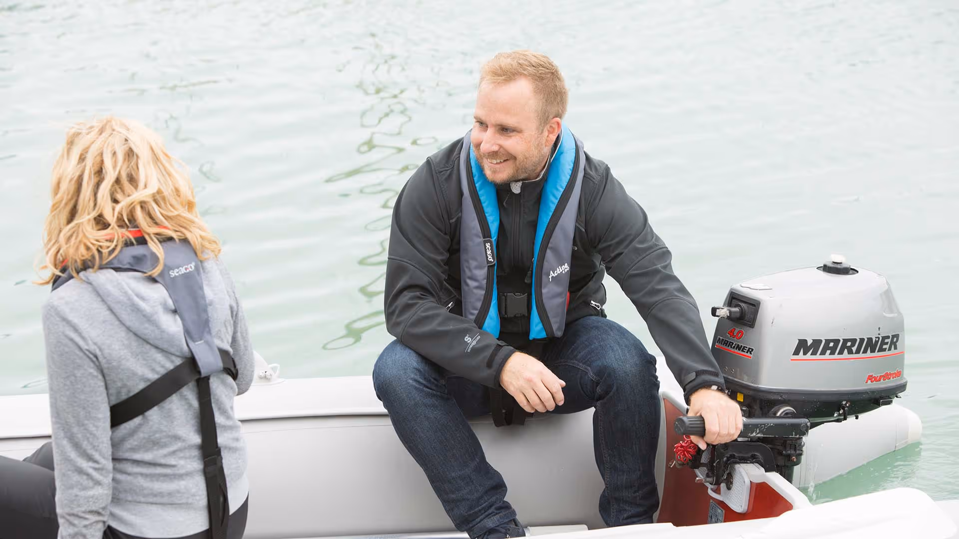 a man and woman on a boat