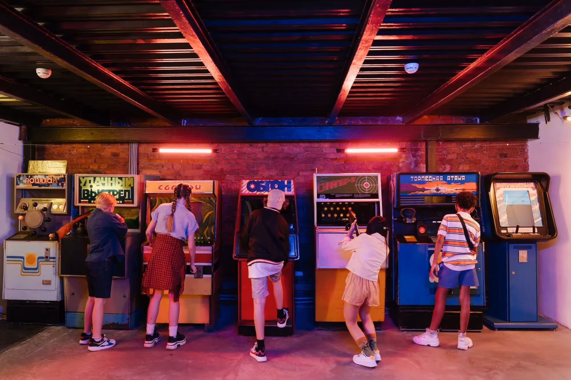 playful kids playing arcade games