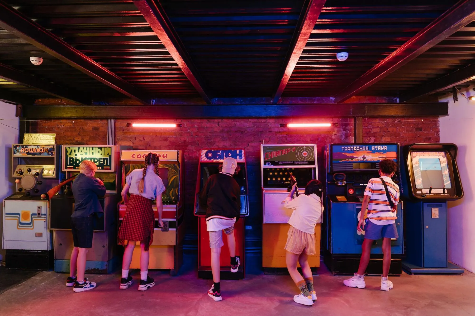 playful kids playing arcade games