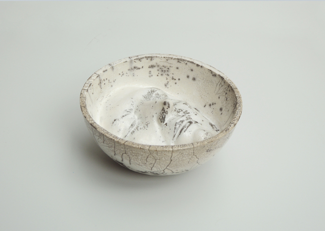 a bowl containing a face
