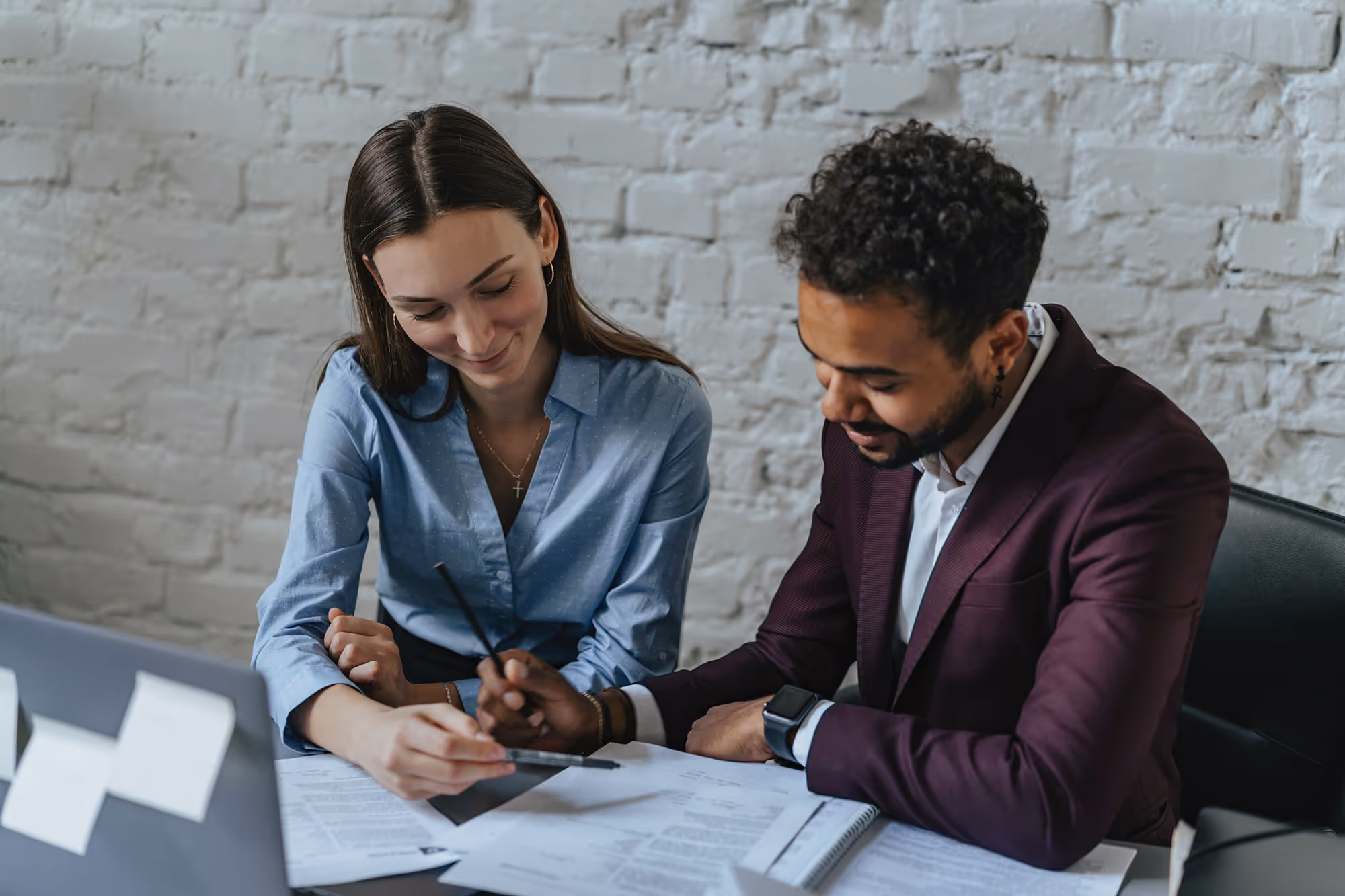 Baker Hill case study header image - Financial services professionals reviewing documents