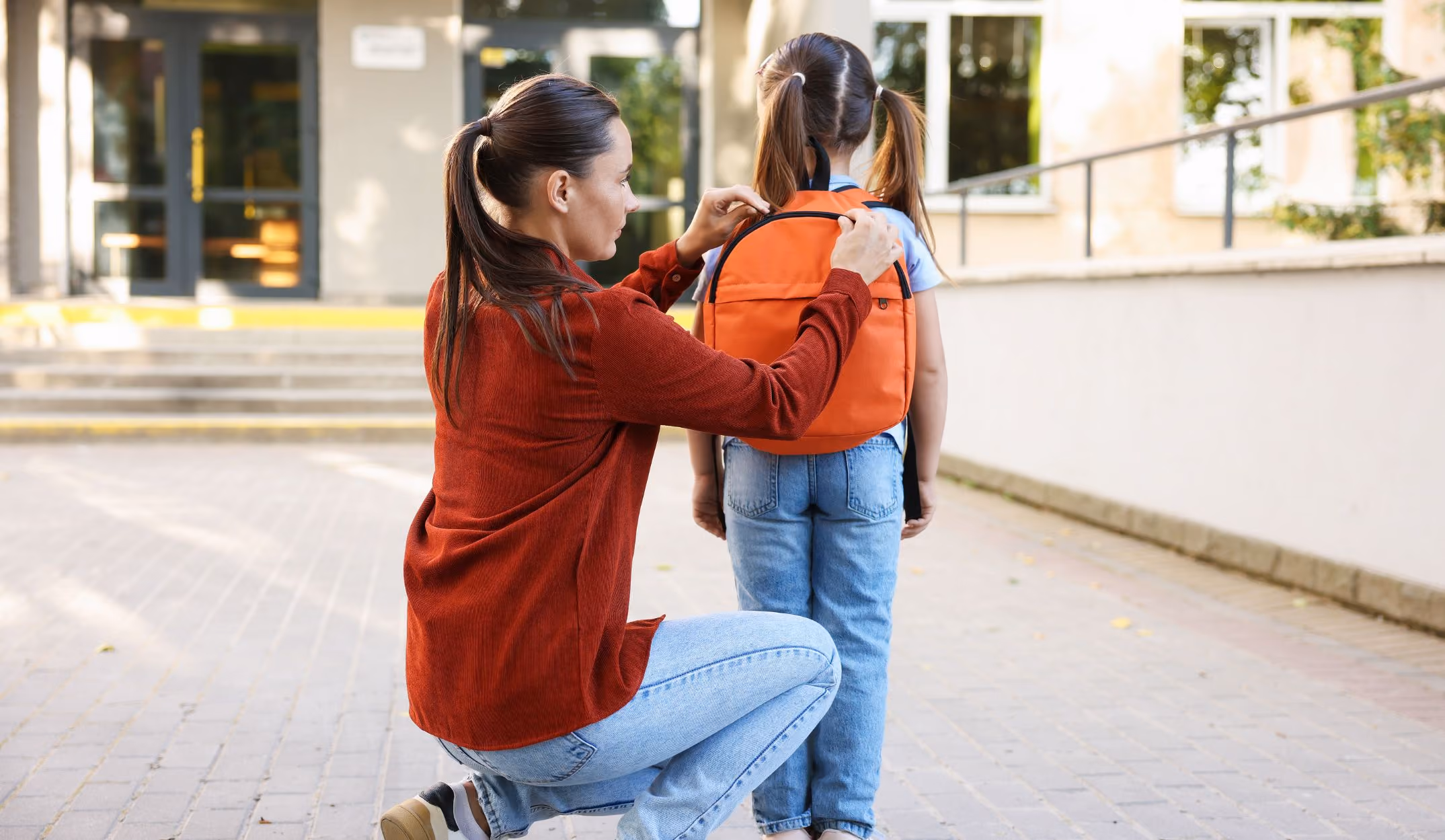 Mom taking child to school
