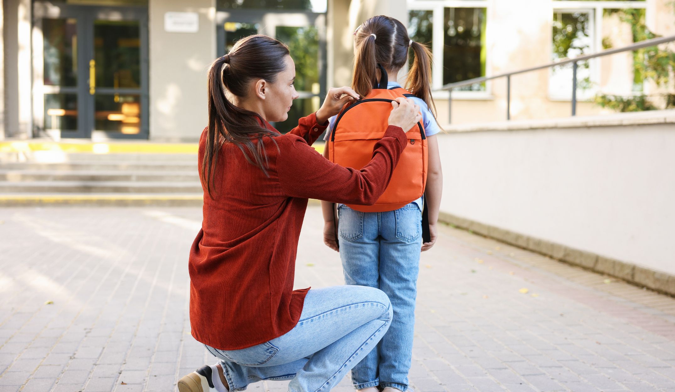 Mom taking child to school