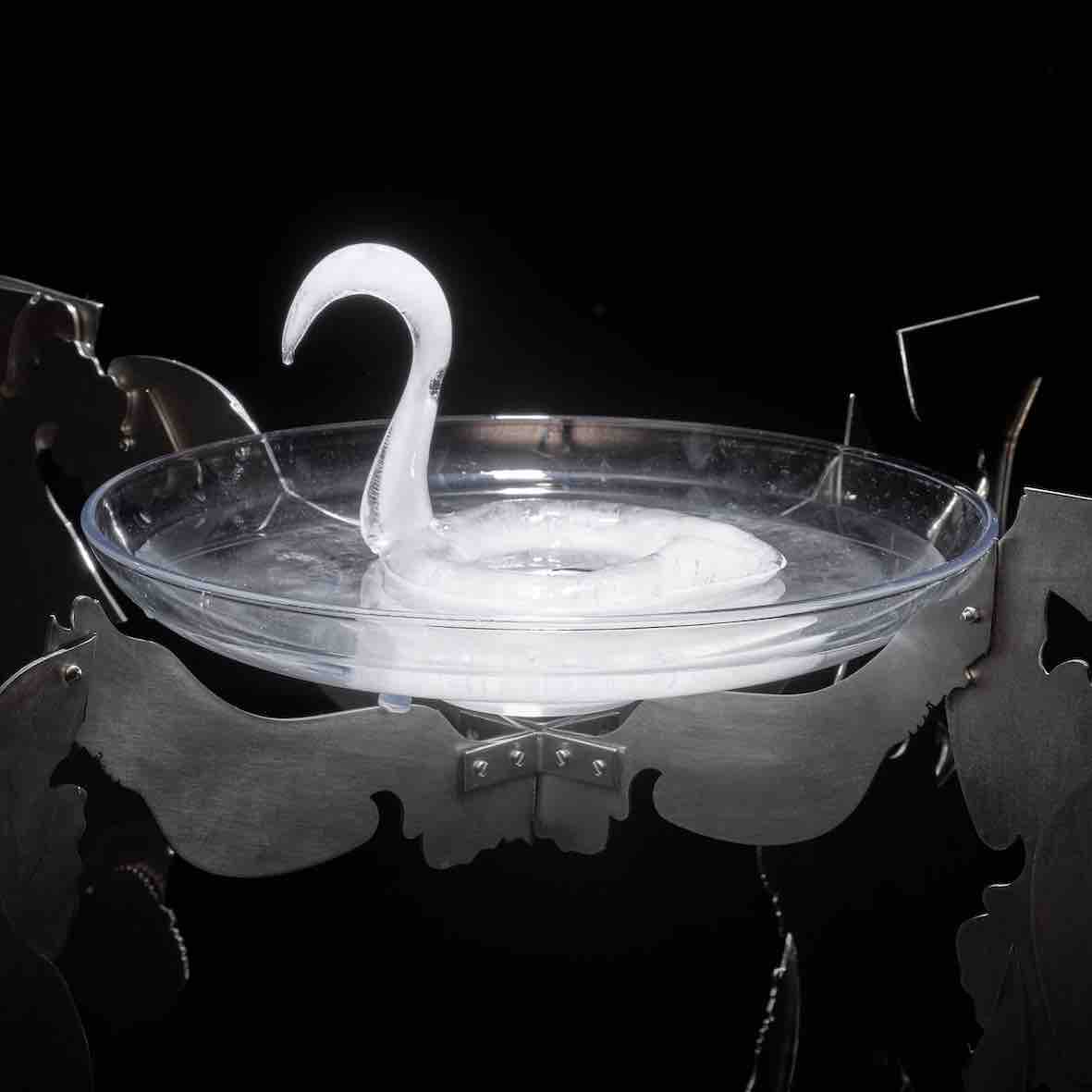 Ice swan in bird bath, artwork, sculpture