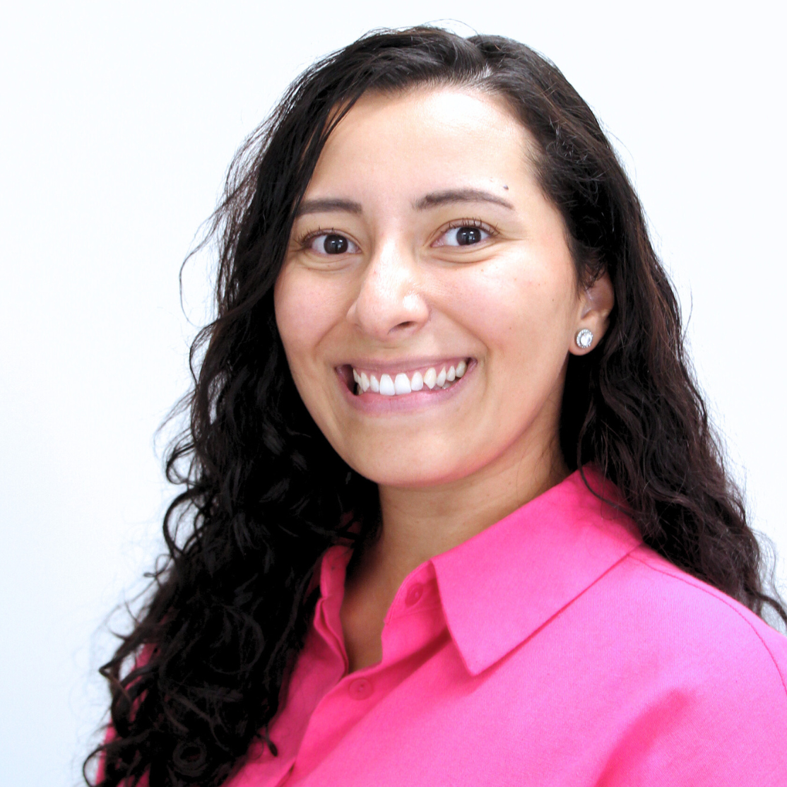 Kirsy's headshot in pink shirt