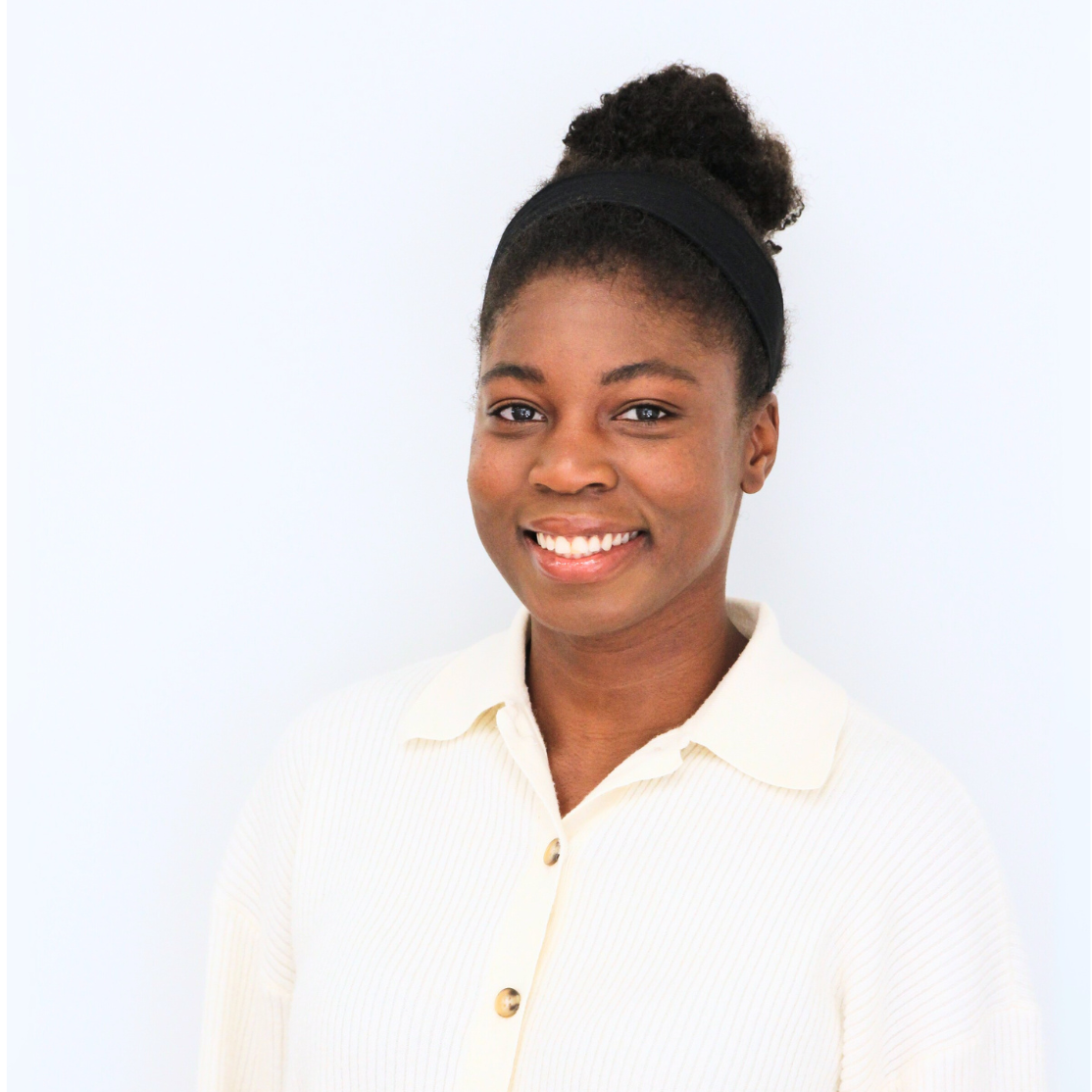 Murielle's headshot in a white shirt