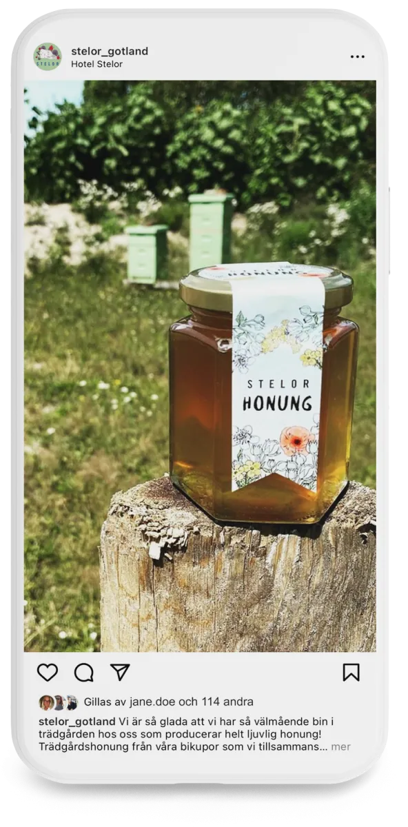 A mobile phone mockup of an Instagram post from Hotel Stelor showing a honey jar.